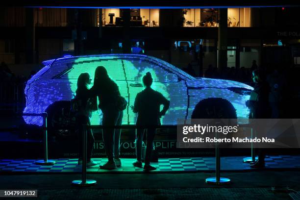 All Eyes on You' by Infinity. The work consists of a QX50 wrapped in approximately 50,000 LED lights that reproduce the visitor shapes. The Canadian...