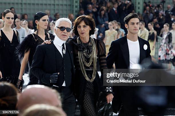 Karl Lagerfeld, Ines de la Fressange and Baptiste Giabiconi walk the runway during the Chanel Ready to Wear Spring/Summer 2011 show during Paris...