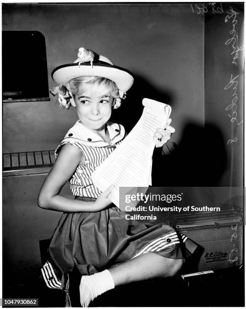 Contract approval, 25 July 1958. Evelyn Rudie -- 8 years;Parakeet 'Pootsy'.;Caption slip reads: 'Photographer: Jim Brezina. Date: . Assignment:...