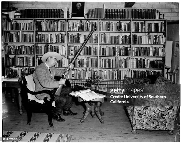 Kernville feature gun and book collection, 21 January 1960. Ardis Walker .;Caption slip reads: 'Photographer: Jensen. Date: . Assignment: Gun & book...