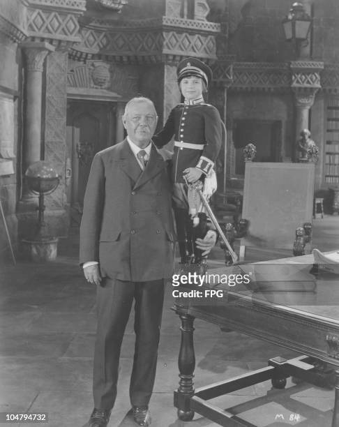 British author Sir Arthur Conan Doyle visits child actor Jackie Coogan on the set of the film 'Long Live the King', in production at the Metro...