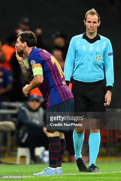 Barcelona forward Lionel Messi sends a kiss to the fans after scoring the third goal during the UEFA Champions League match between Tottenham Hotspur...