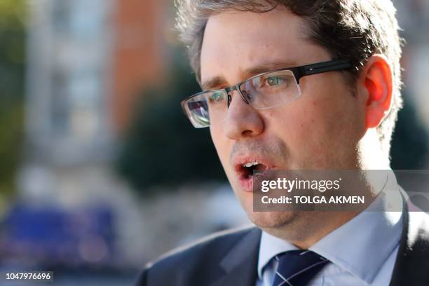 Eliot Higgins, founder of online investigation group Bellingcat, speaks to the media on College Green in London on October 9, 2018 after making a...