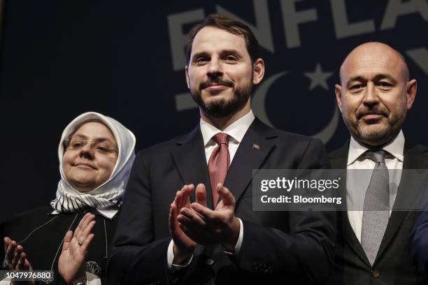 Berat Albayrak, Turkey's treasury and finance minster, center, applauds following a news conference in Istanbul, Turkey, on Tuesday, Oct. 9, 2018....