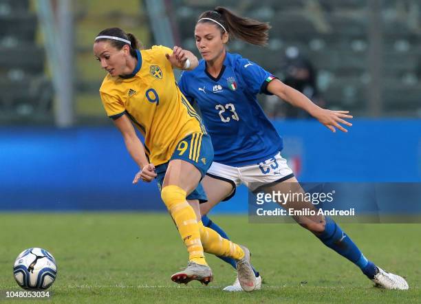 Kosovare Asllani of Sweden is challenged by Cecilia Salvai of Italy during the International Friendly match between Italy Women and Sweden Women at...