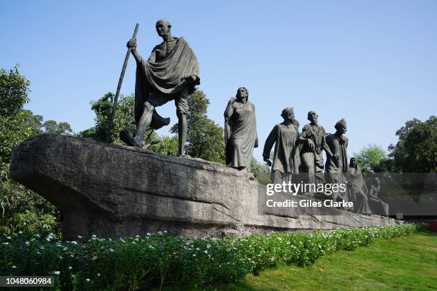 On Mother Theresa Crescent in Delhi was created by Devi Prasad Roy Chowdhury shows ten representative Indian people all following Gandhi on his 1930...