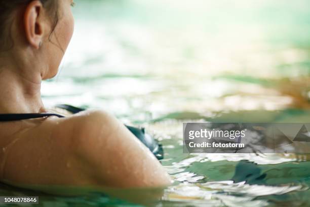 meditating in hot tub - hydrotherapy stock pictures, royalty-free photos & images