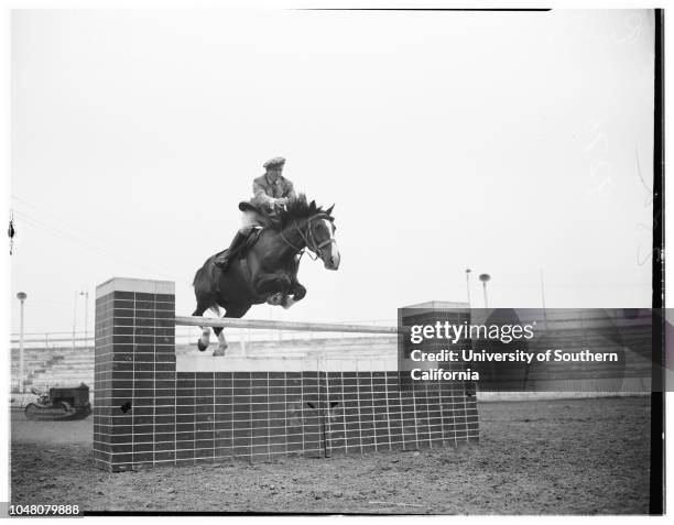 National Horseshow, 26 May 1949. Rudy Smithers;J.J Kessler ;Horse with blinkers is 'Rex Qui Saleet');Other horse is 'Hop-A-Long'.;Caption slip reads:...