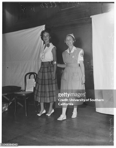 Models at Blood Bank located at Pasadena Elk's Club, 30 August 1951. Marlene Maag -- 20 years ;Mrs E.R Engel .;Caption slip reads: 'Photographer:...