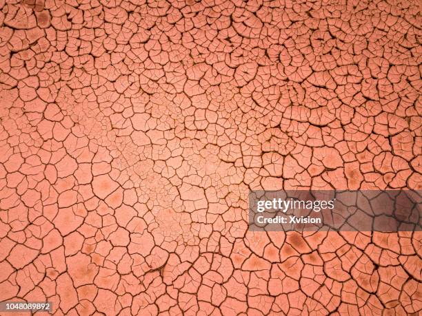 cracked red land aerial view - arid ground stock pictures, royalty-free photos & images