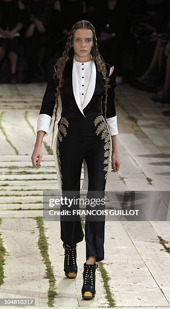 Model presents a creation by British designer Sarah Burton for Alexander McQueen during the Spring/Summer 2011 ready-to-wear collection show on...