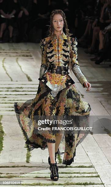 Model presents a creation by British designer Sarah Burton for Alexander McQueen during the Spring/Summer 2011 ready-to-wear collection show on...