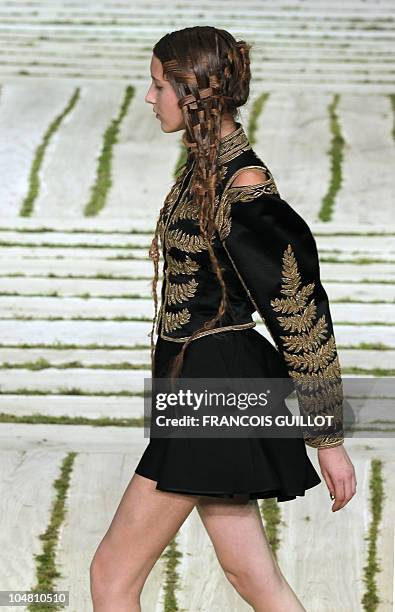 Model presents a creation by British designer Sarah Burton for Alexander McQueen during the Spring/Summer 2011 ready-to-wear collection show on...