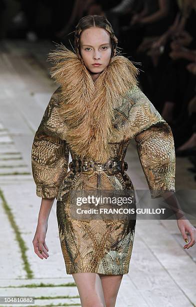 Model presents a creation by British designer Sarah Burton for Alexander McQueen during the Spring/Summer 2011 ready-to-wear collection show on...