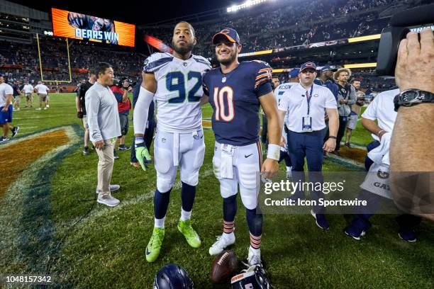 Chicago Bears quarterback Mitchell Trubisky and Seattle Seahawks defensive tackle Nazair Jones pose for a photo after game action during an NFL game...