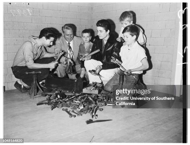 Man gives gift of tools to family of eleven children who rebuild old cars in back yard as hobby, 28 November 1951. Jack Repp, donor;David Henkels,...