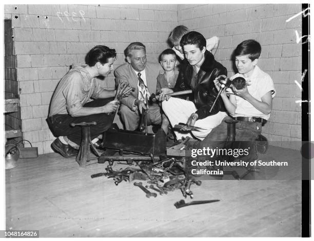 Man gives gift of tools to family of eleven children who rebuild old cars in back yard as hobby, 28 November 1951. Jack Repp, donor;David Henkels,...