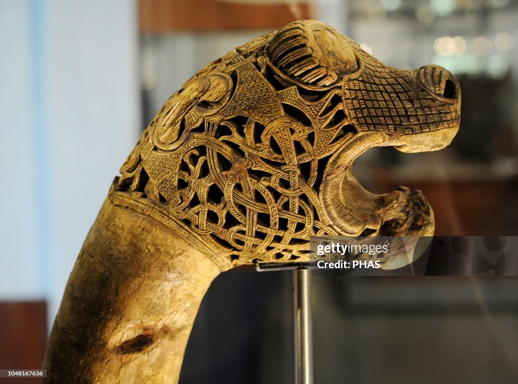 Animal-head post carved in wood