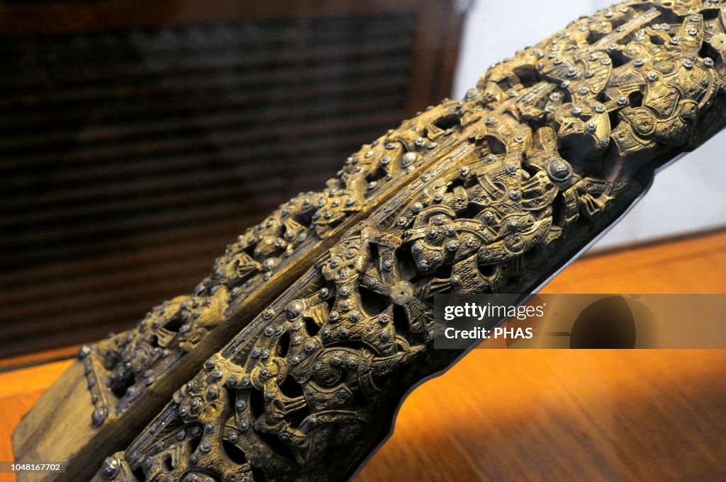 Remains of a wooden sleigh, decorated with reliefs and silver and bronze nails