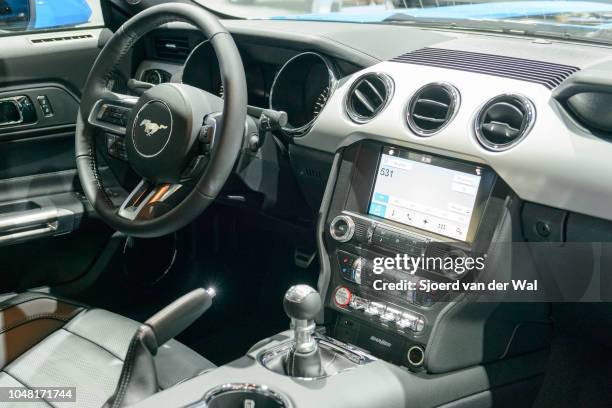 Interior and dashboard of a Ford Mustang American Muscle car on display at Brussels Expo on January 13, 2017 in Brussels, Belgium. The sixth...