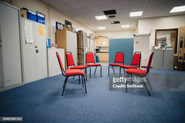 group therapy room - aa meeting stock pictures, royalty-free photos & images