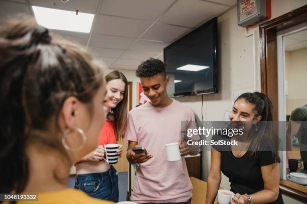teenagers relaxing at youth club - community building stock pictures, royalty-free photos & images