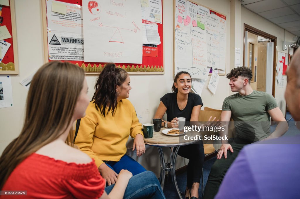 Teenagers Relaxing with Tea at Youth Club