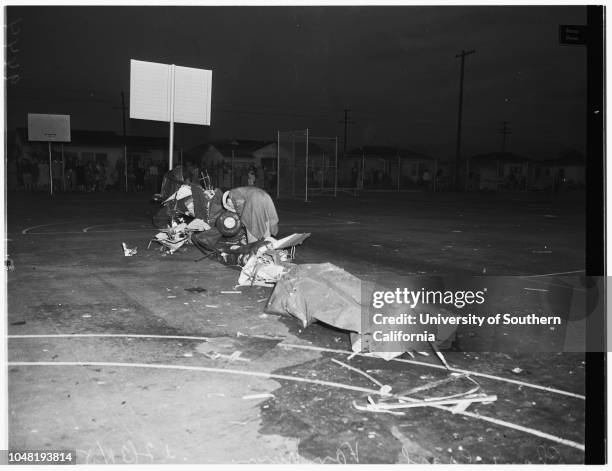 Plane crash kills two, 31 December 1951. Jay Campbell -- 30 years;Judy Campbell -- 8 years.;Caption slip reads: 'Photographer: Glickman. Date: ....