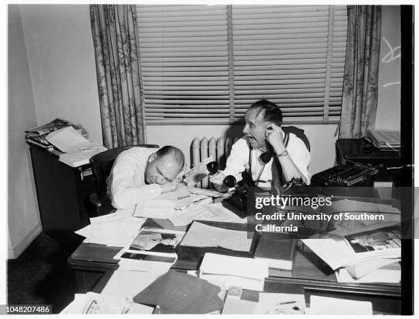 Preparation of floats for Rose Parade, 29 December 1951. Irving Yabner, wiping off elephant on South Pasadena float;Moe Bear, wiping off elephant on...