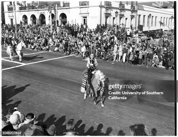 Individuals in Rose Parade also groups on horseback, 1 January 1952. Roy Rogers, on horseback;Dale Evans, his wife, also on horseback;William Boyd,...