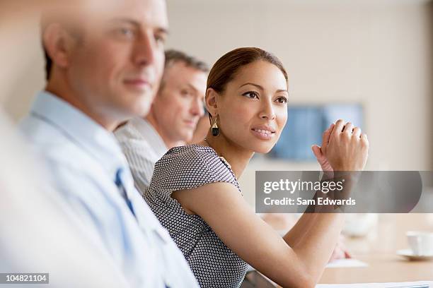 business people listening in meeting - office leaning stock pictures, royalty-free photos & images