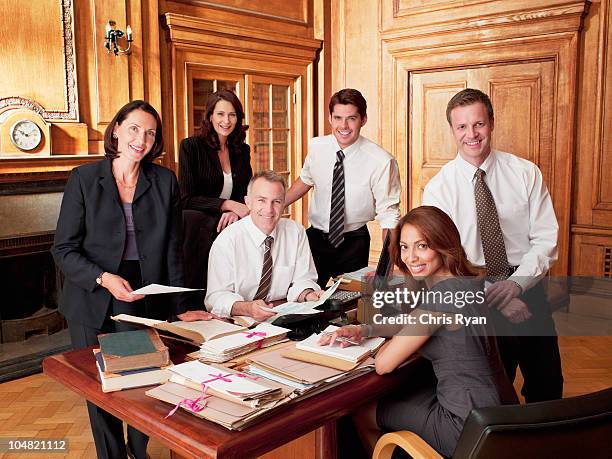 smiling lawyers in office - lawyer office stock pictures, royalty-free photos & images