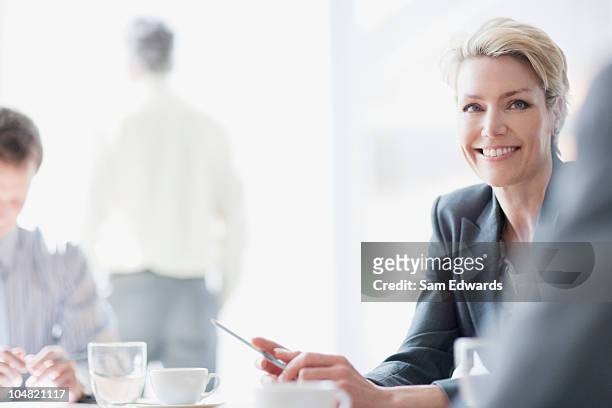 smiling businesswoman in meeting - lighting technique bildbanksfoton och bilder