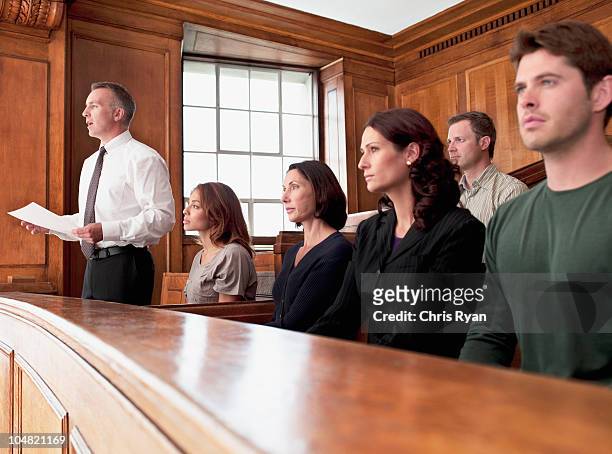jury sitting in courtroom - person justice stock pictures, royalty-free photos & images