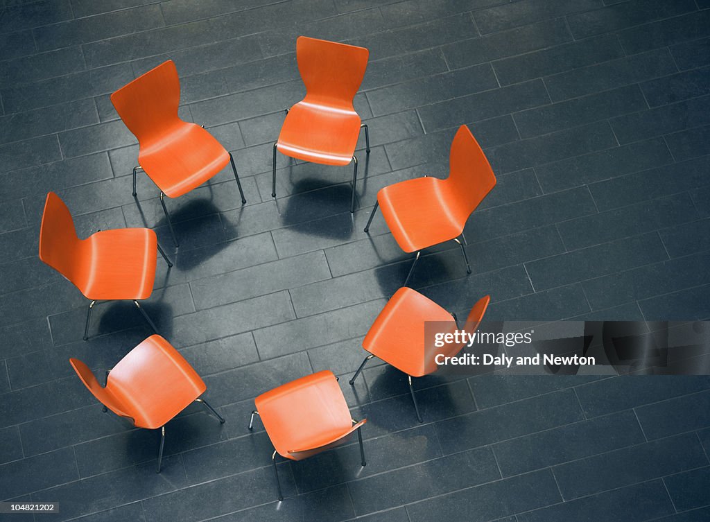 Circle of empty chairs