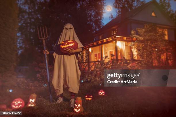 spooky ghost near haunted house at halloween - vintage haunting stock pictures, royalty-free photos & images