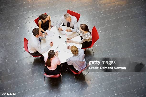 business people having a meeting at round table - round table imagens e fotografias de stock