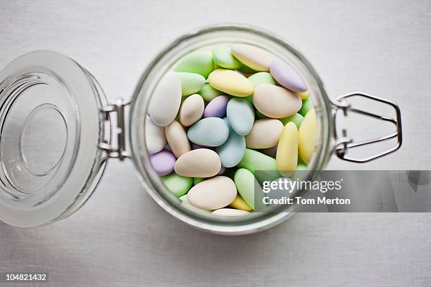 jar of pastel candies - sweet jar stock pictures, royalty-free photos & images