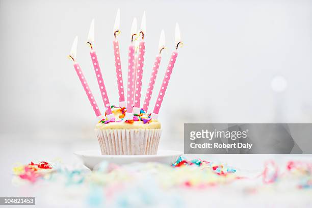 birthday candles on cupcake - anniversary stock pictures, royalty-free photos & images