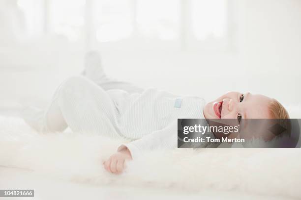 Baby On Rug Baby Laying On Rug Photos and Premium High Res Pictures - Getty Images