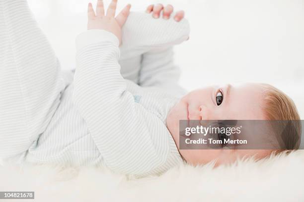 Baby On Rug 648 Baby Laying On Rug Stock Photos, High-Res Pictures, and Images ...
