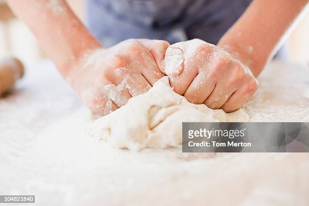 close up of girl kneading dough - knåda bildbanksfoton och bilder