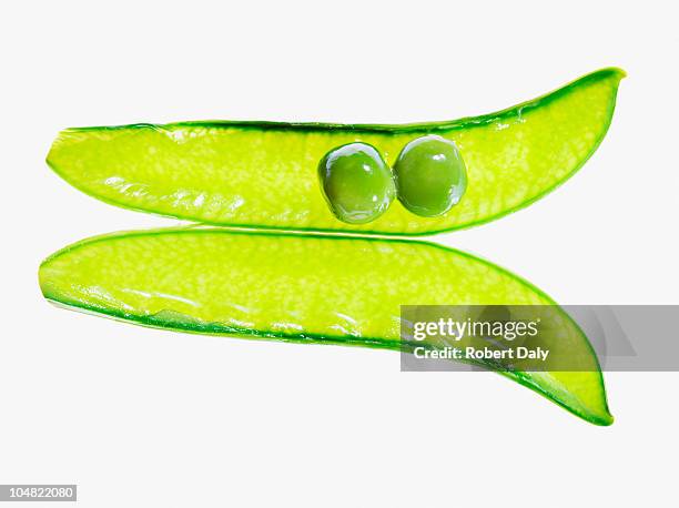 close up of two peas in pea pod - peas stock pictures, royalty-free photos & images