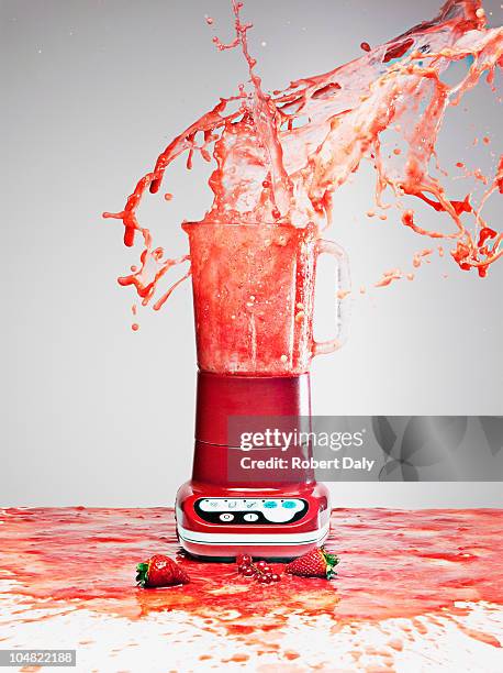 berry juice splashing from blender - liquidiser stock pictures, royalty-free photos & images