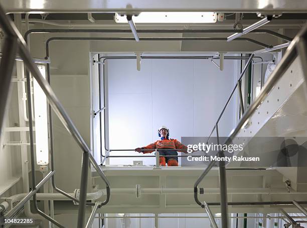 engineer in ship's engine room - underside stock pictures, royalty-free photos & images