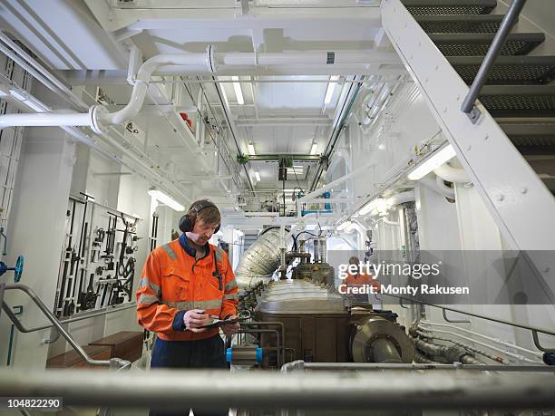 engineers in ship's engine room - エンジンルーム ストックフォトと画像