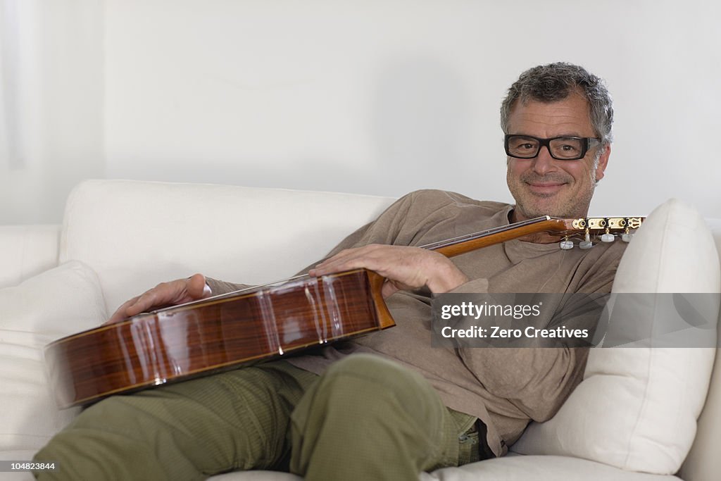 Man sitting with guitar