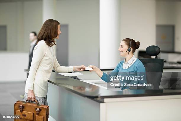 woman in a lobby - germany interior of office reception stock pictures, royalty-free photos & images