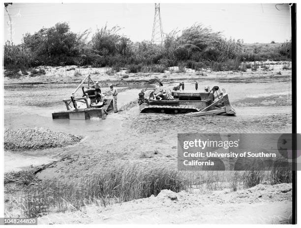 Bulldozers stuck in quicksand , 10 May 1952. Los Angeles Sheriff Deputy Joe H. Welever..