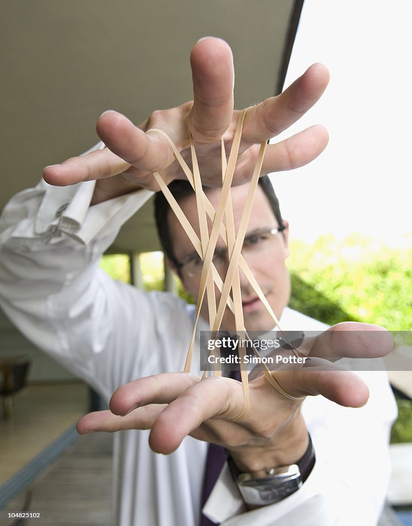 Man stretches elastic bands